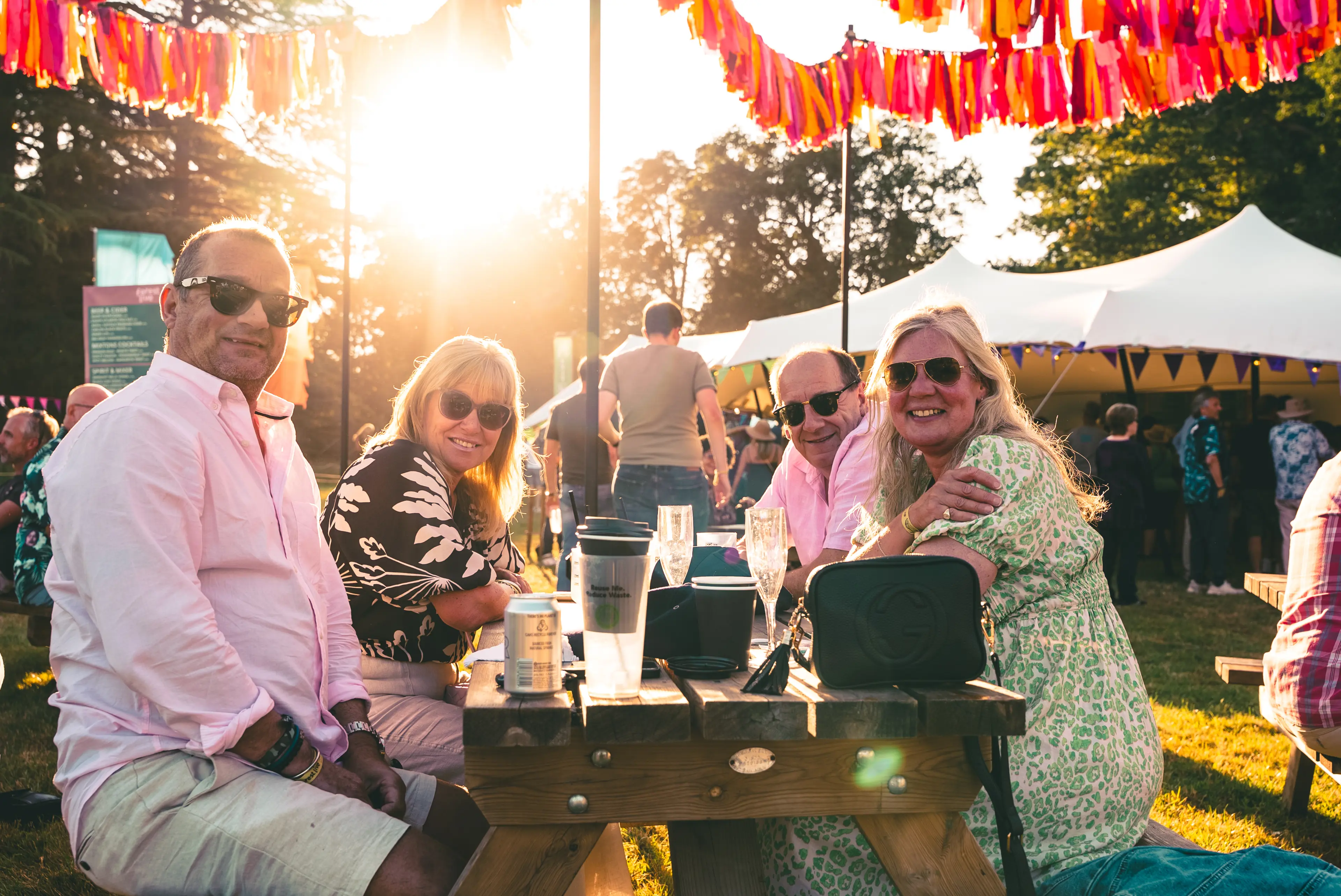 A group of people sat at a picnic table in Glade VIP