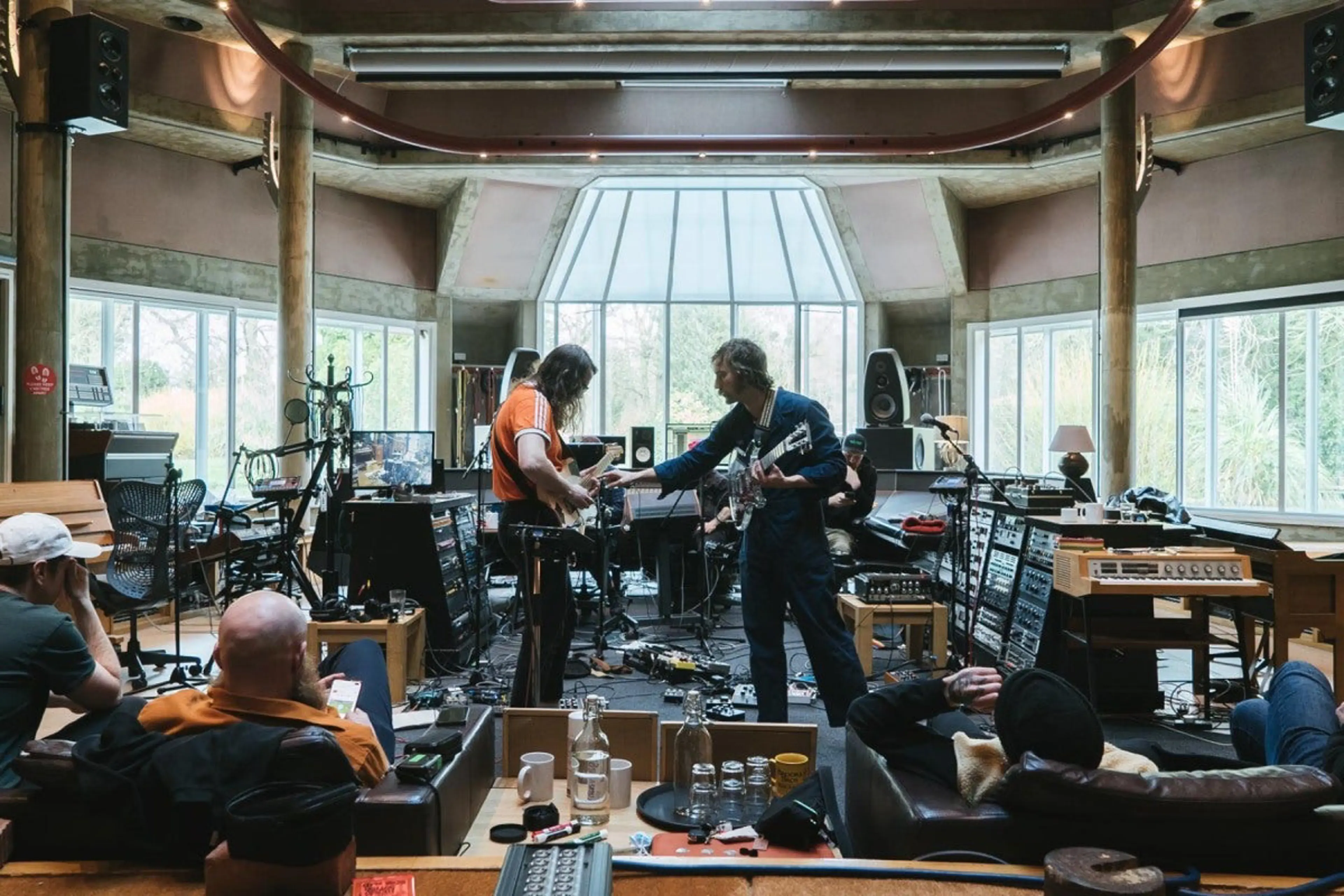 Behind the scenes of the British rock band and the prolific hip-hop producer’s studio collaborations