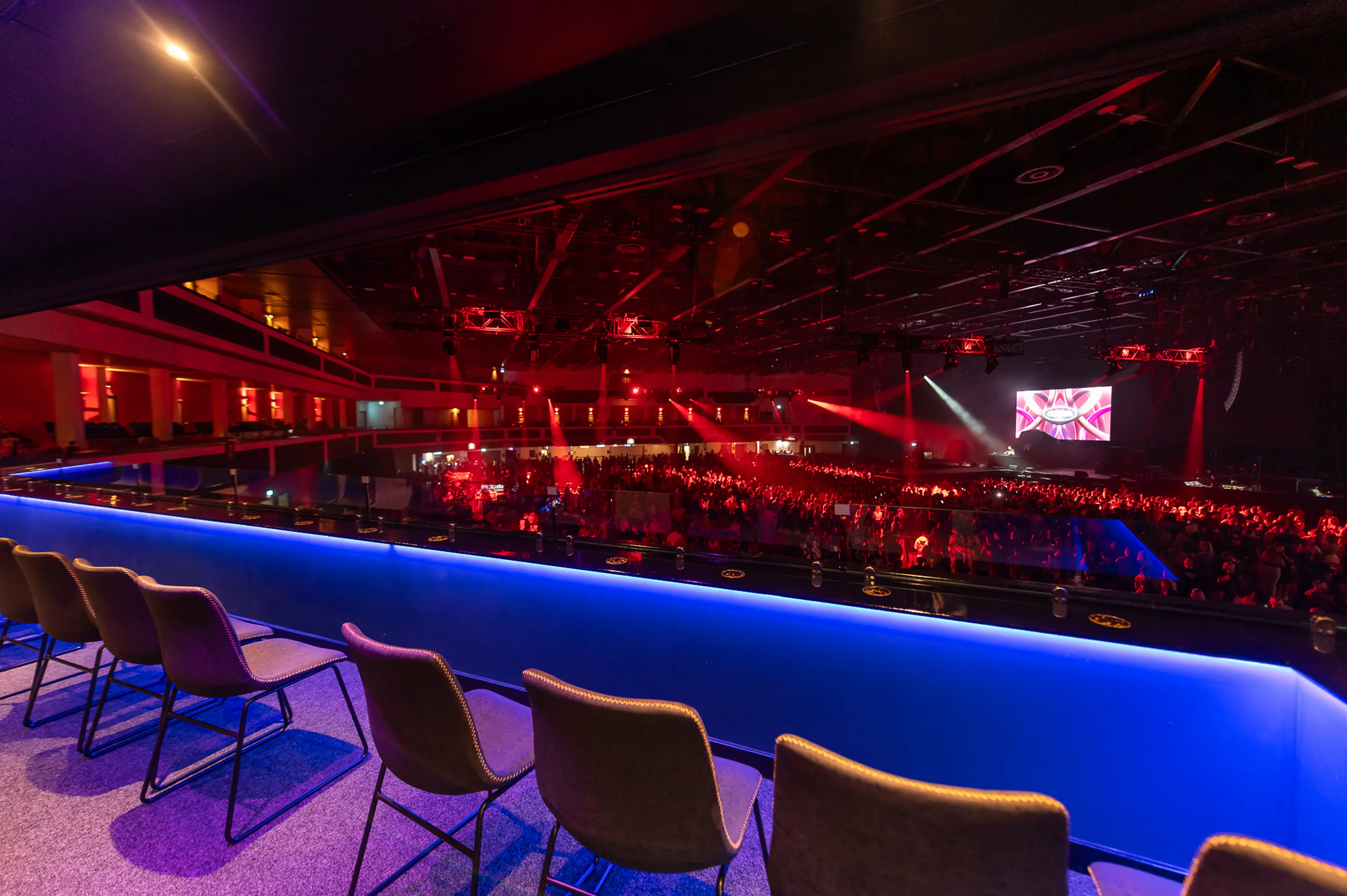 A view of the Energise Club at Utilita Arena Cardiff, with chairs against a balcony.