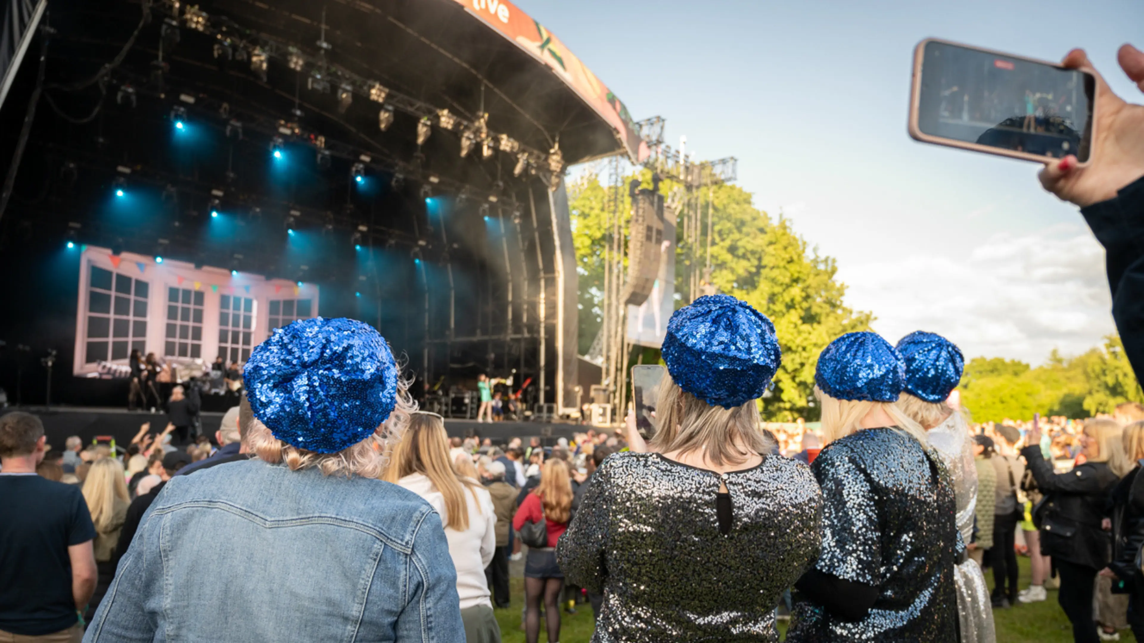 Three women watching Sophie Ellis-Bextor from Glade VIP