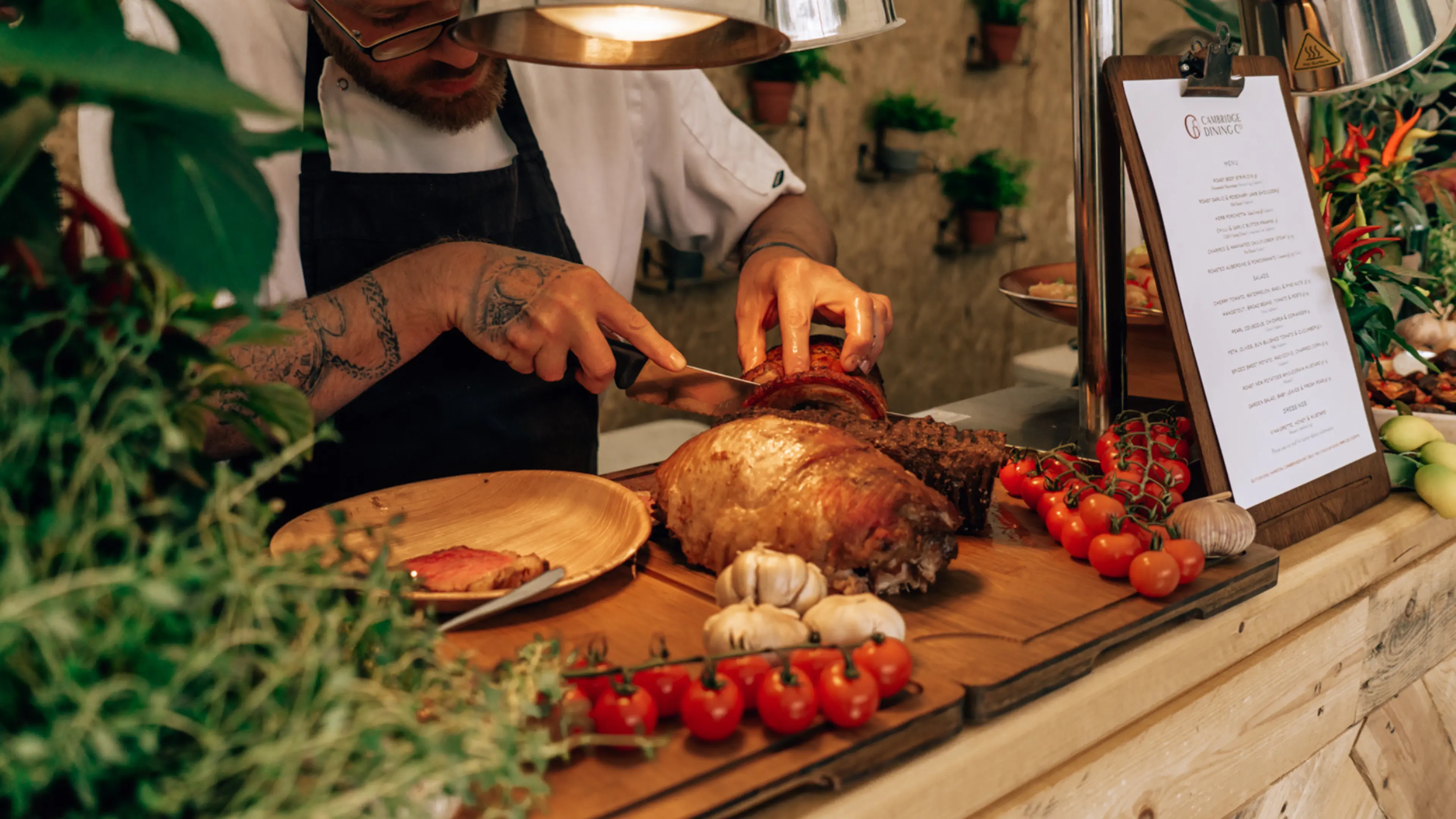 Meat being carved in the TK Maxx presents Bedford Summer Sessions VIP area. 