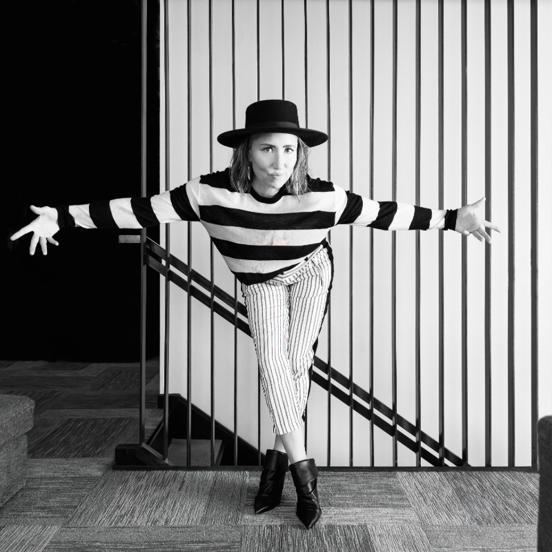 artist KT Tunstall wearing a striped black and white top posing for a photo