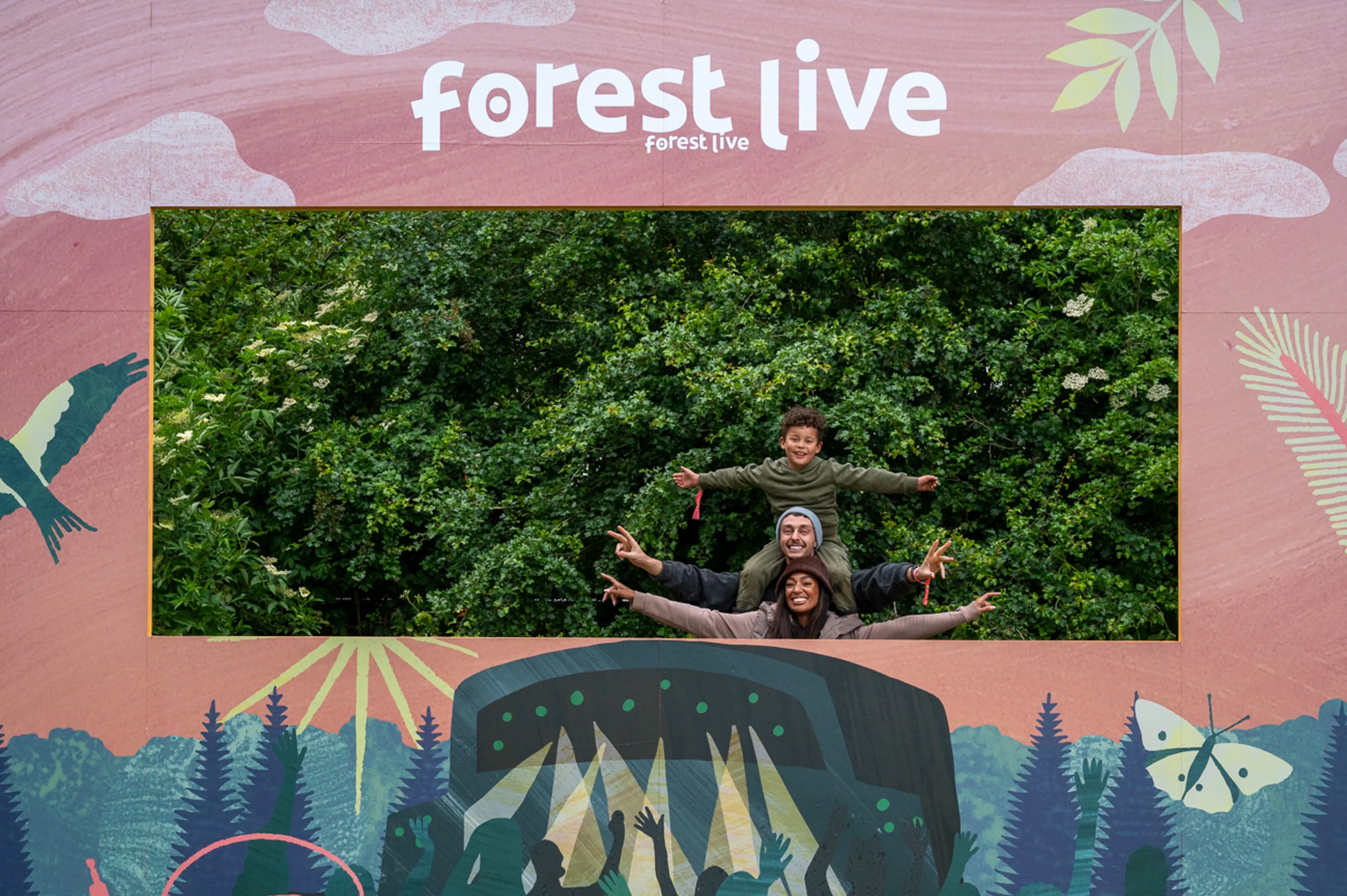 People standing in the Forest Live concert sign