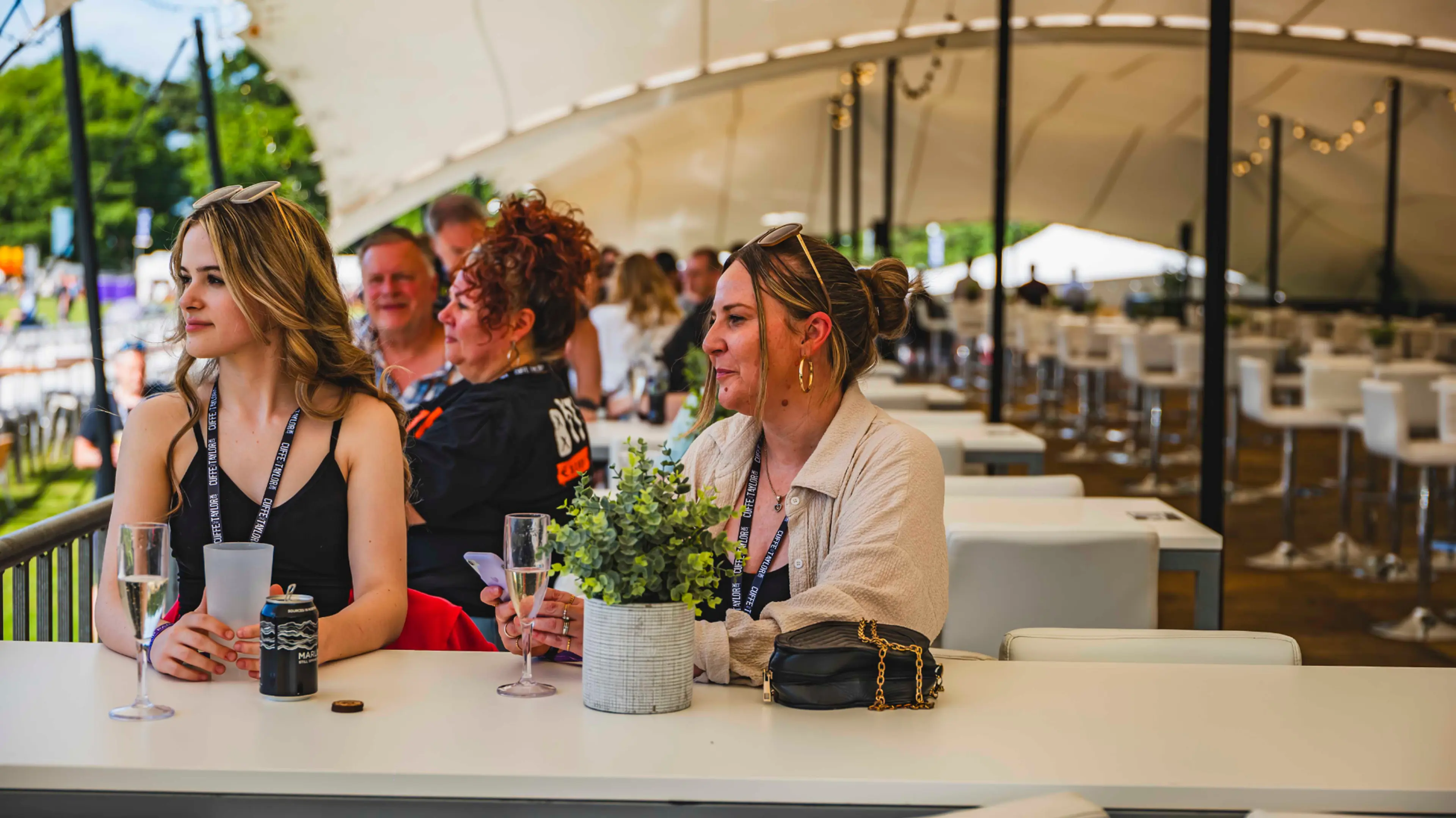 People sat in The Terrace with tent cover