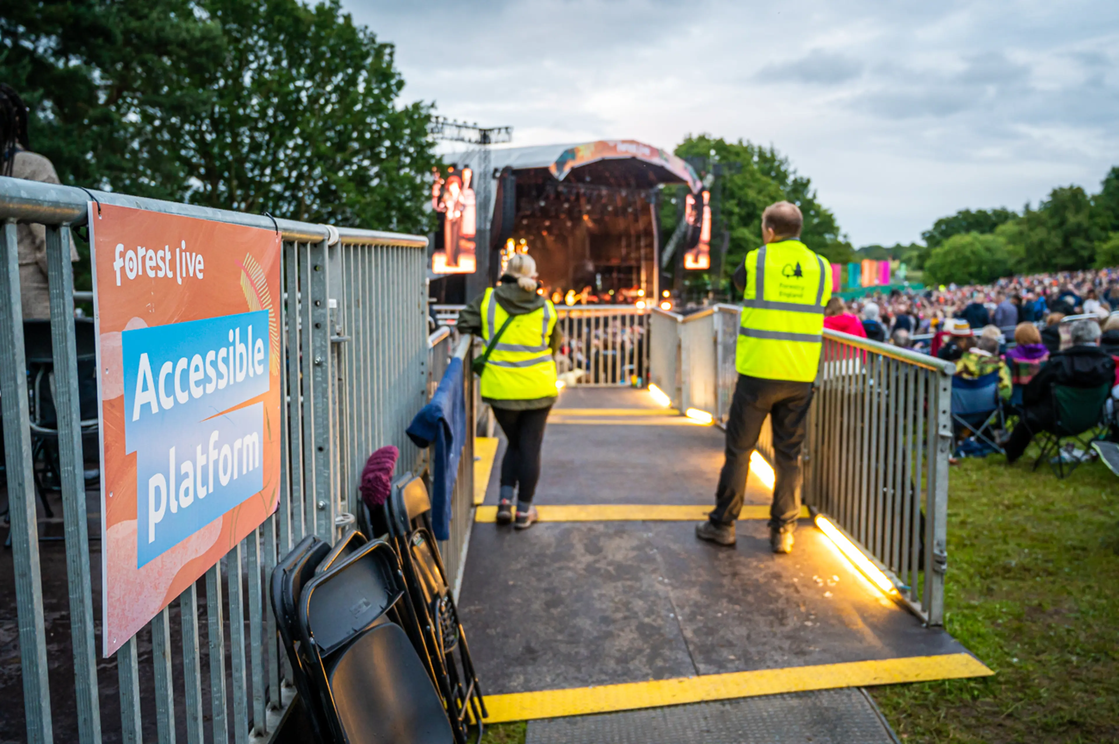 Volunteers standing on the accessible platform at Forest Live