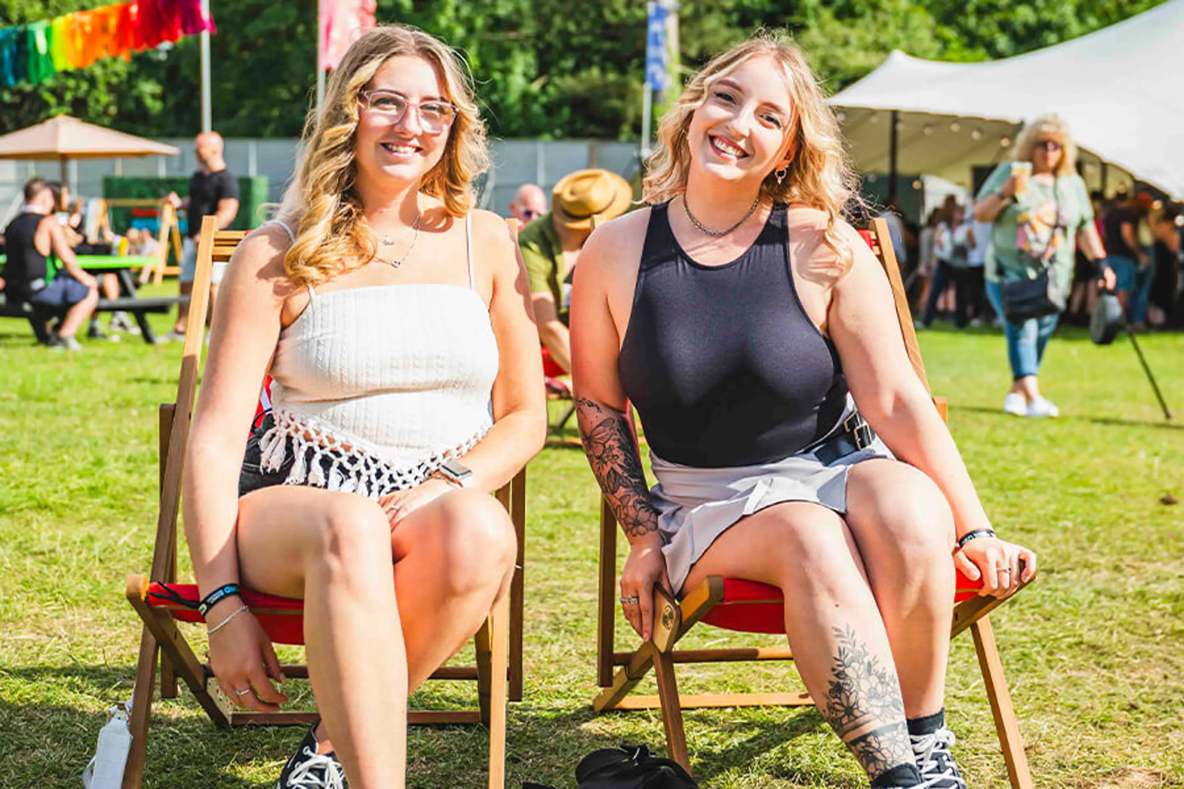 2 girls taking a seat in the VIP garden