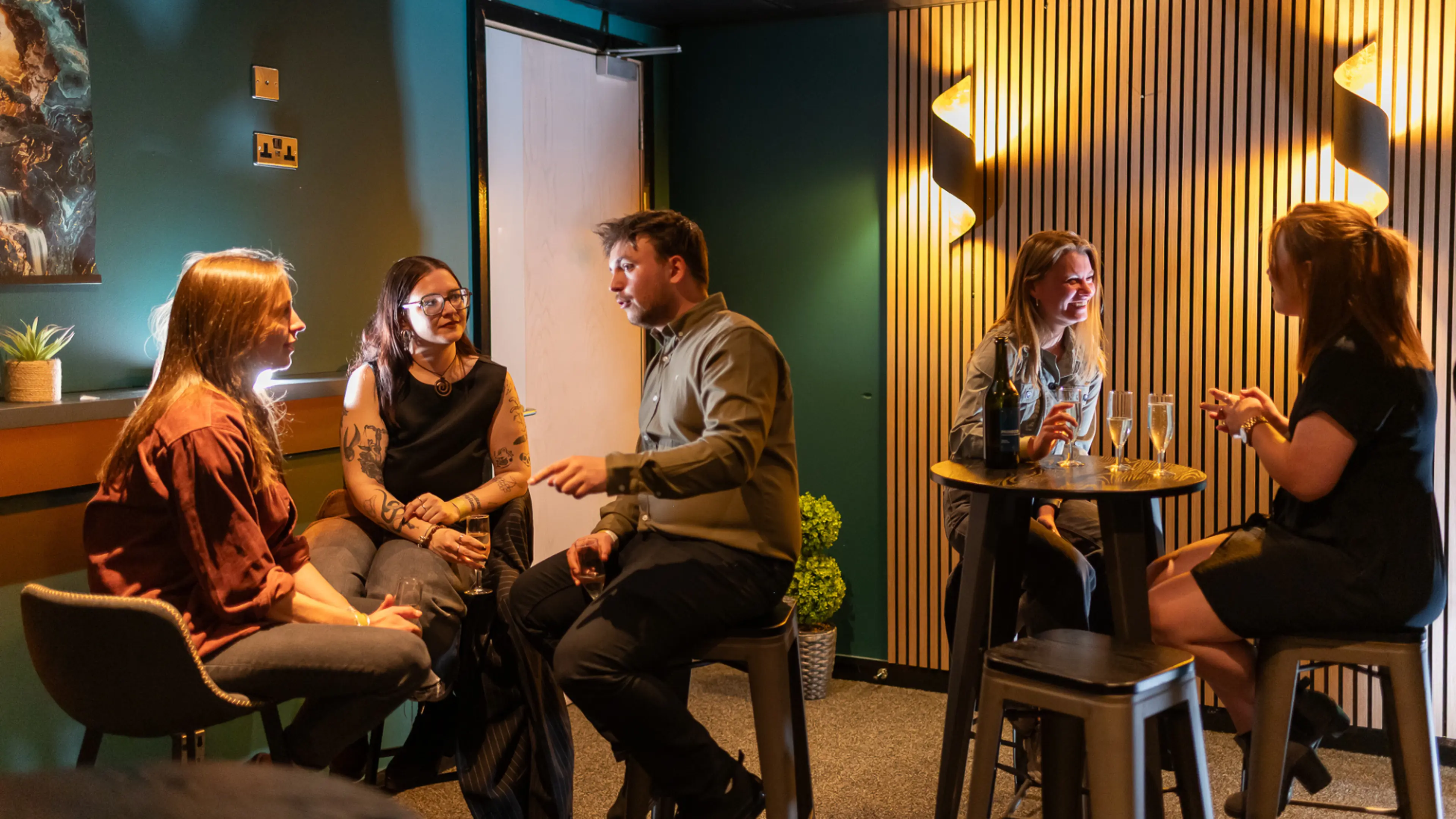 The Suite Experience at Utilita Arena Cardiff, full of people chatting, drinking and having a good time.