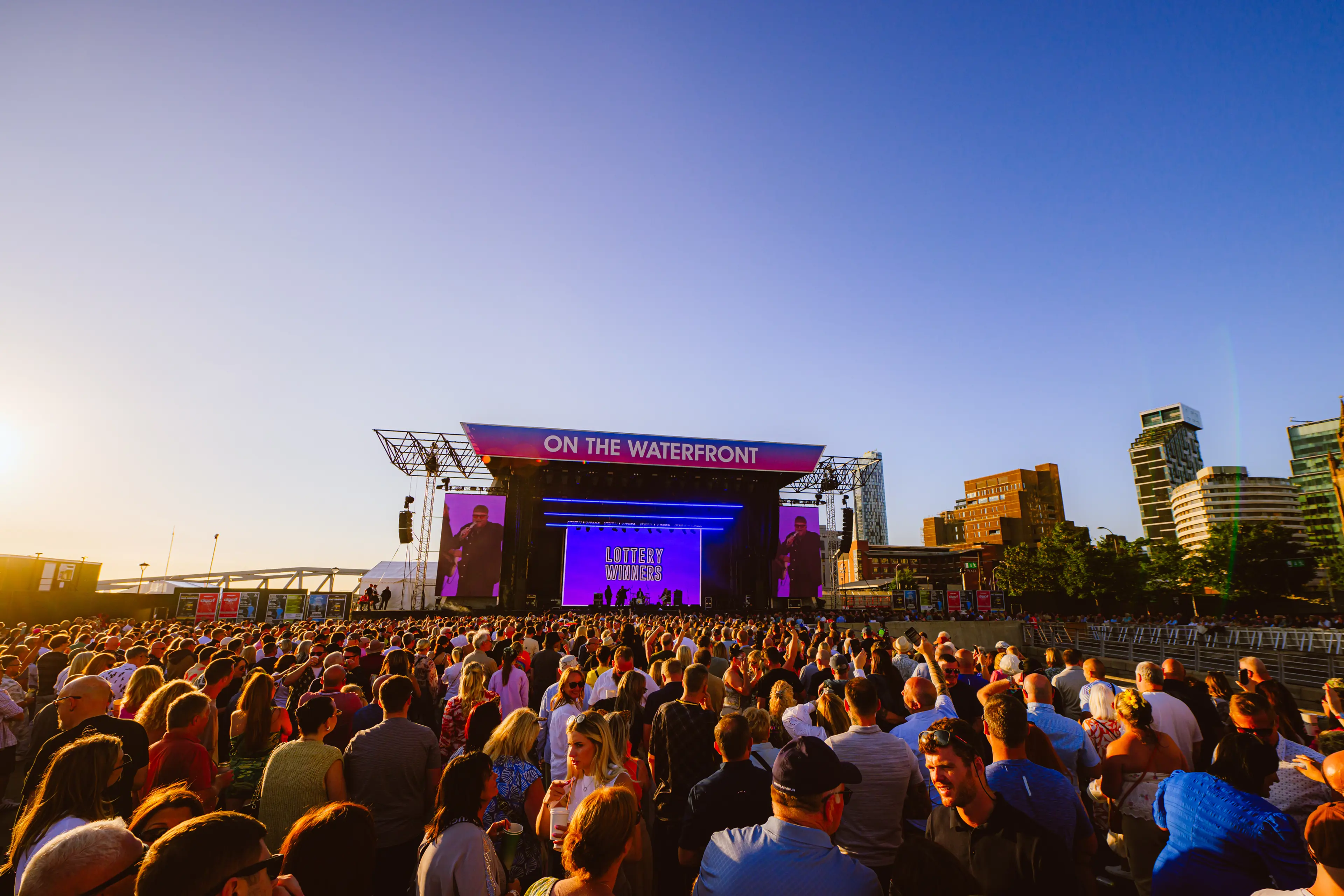 on the waterfront stage at sunset