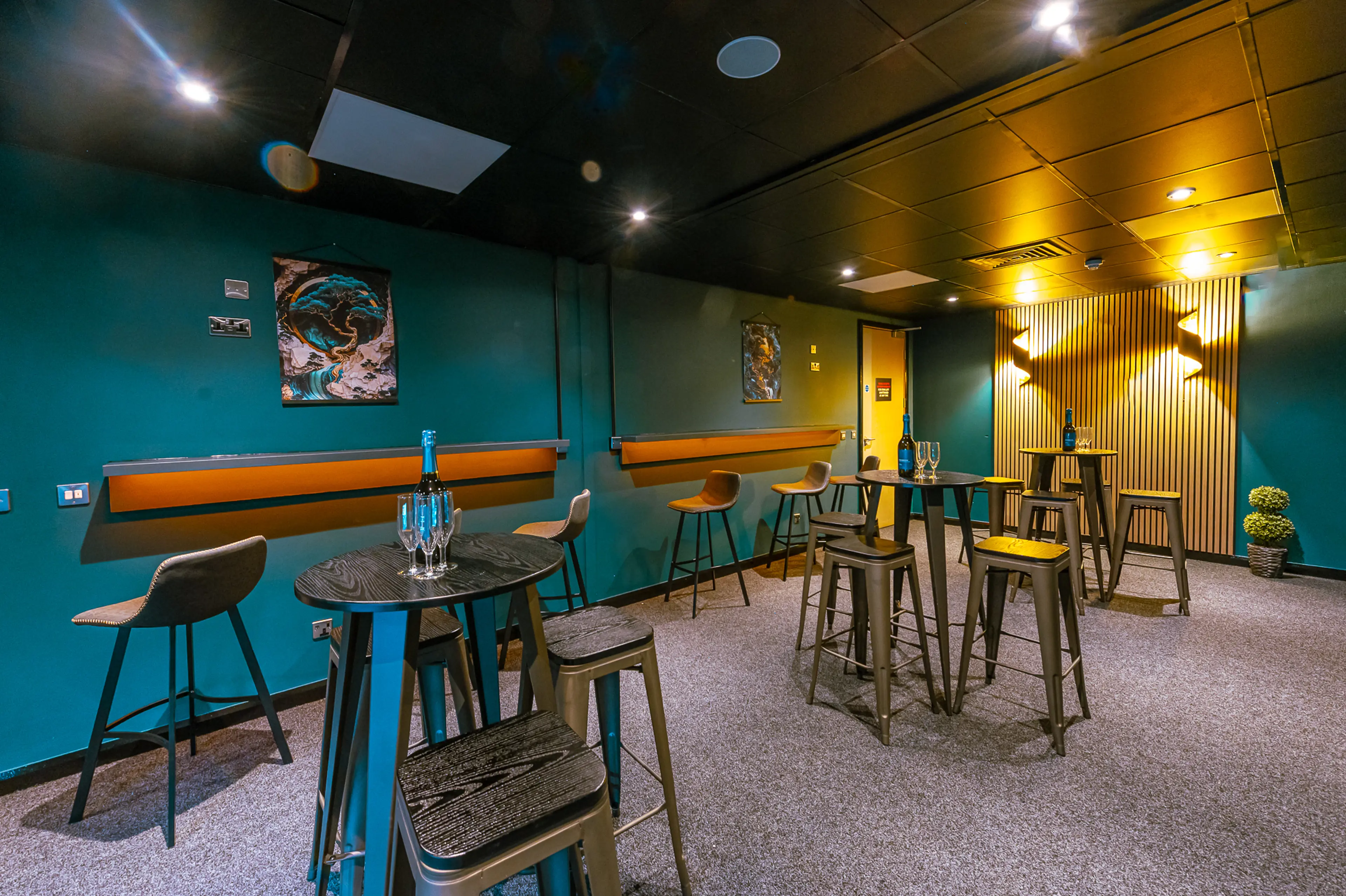 The Suite Experience at Utilita Arena Cardiff, with tables and chairs dotted around the room.